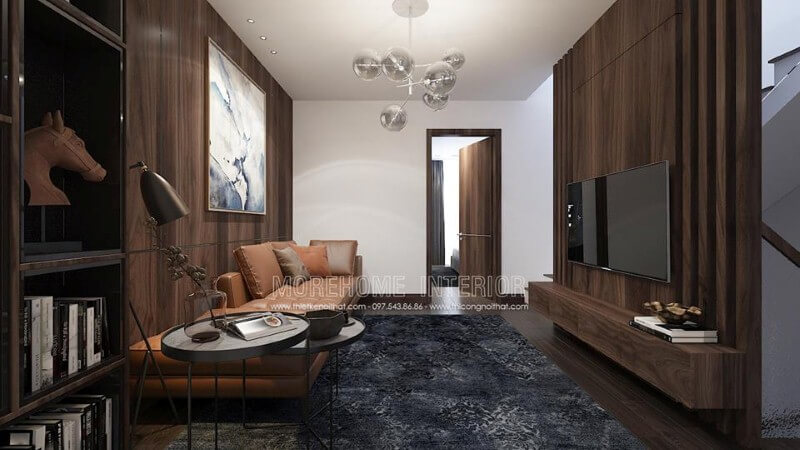 Điểm nhấn sofa da màu cam ấn tượng cho phòng khách hiện đại trang trí tường từ gỗ ốp tối màu. Thiết kế nội thất phòng khách biệt thự