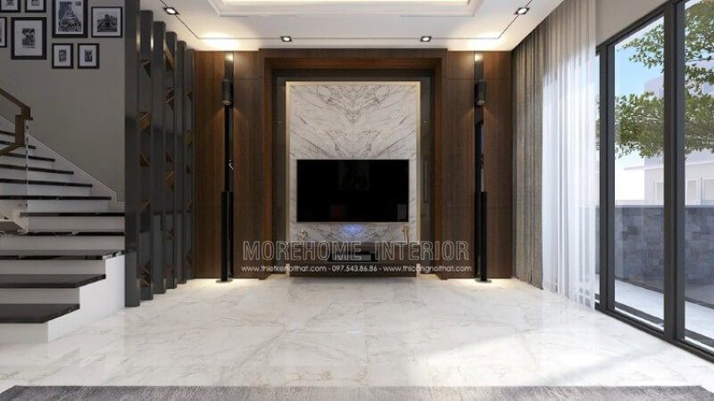 Bố trí nội thất phòng khách đẹp, sang trọng với ý tưởng sử dụng khối đá trắng lớn đối vân ốp tường phòng khách được tôn lên bởi vẻ đẹp trầm từ mảng tường gỗ.