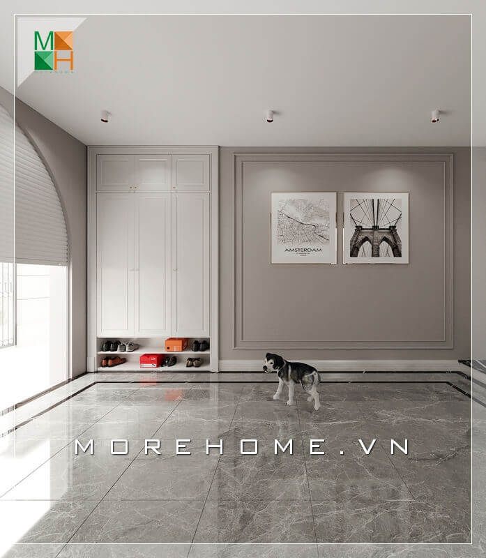 Mẫu tủ gỗ để giày màu trắng thiết kế âm tường đẹp và hiện đại được đặt trong không gian nhà để xe rất tiện lợi.